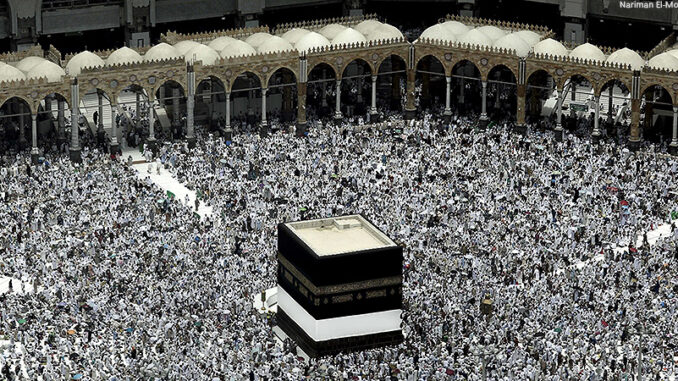 091216_03P_FS Muslim pilgrims prepare themselves for Friday prayers in front of the Kaaba, Islam's holiest shrine, at the Grand Mosque in the Muslim holy city of Mecca, Saudi Arabia.