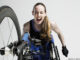 Overjoyed female wheelchair athlete,