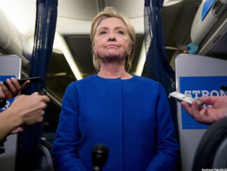 Democratic presidential candidate Hillary Clinton pauses while she gives remarks on the explosion in Manhattan's Chelsea neighborhood onboard her campaign plane at Westchester County Airport, in White Plains, N.Y., Saturday, Sept. 17, 2016,
