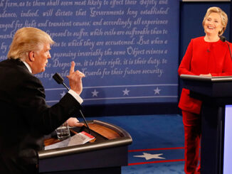 Democratic presidential nominee Hillary Clinton smiles as Republican presidential nominee Donald Trump speaks during the presidential debate at Hofstra University in Hempstead, N.Y., Monday, Sept. 26, 2016.