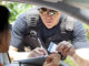 Crime: Policeman gives driver a traffic ticket. Pamela Moore/Getty Images. MHE Canada;MHE USA