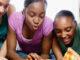 Five Teenagers Eating Pizza. Corbis Premium RF/Alamy. MHE World