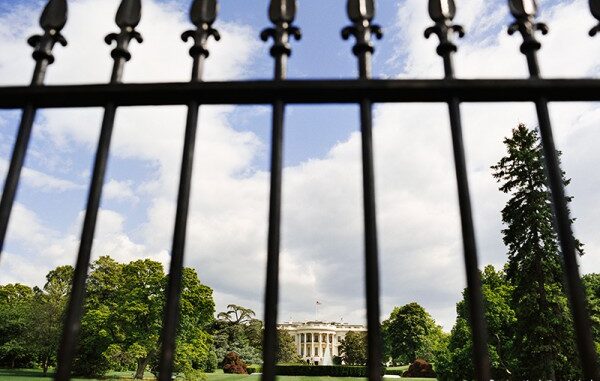 101014_01P_INTS The White House in Washington, D.C. behind a iron fence.