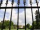 The White House in Washington, D.C. behind a iron fence.