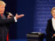 Republican presidential nominee Donald Trump speaks with Democratic presidential nominee Hillary Clinton during the second presidential debate at Washington University in St. Louis, Sunday, Oct. 9, 2016.