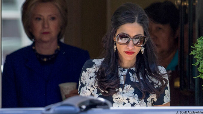 103116_03P_FS Top Clinton aide Huma Abedin walks ahead of Democratic presidential candidate Hillary Clinton following a private meeting with Sen. Elizabeth Warren, D-Mass., Friday, June 10, 2016, at Clinton's home in Washington.
