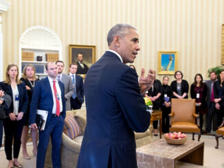 President Barack Obama speaks with staff in the Oval Office, Nov. 9, 2016.