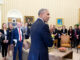 President Barack Obama speaks with staff in the Oval Office, Nov. 9, 2016.