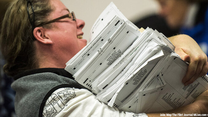 121416_03P_FS Election workers recount votes on Flint ballots, as they begin the process of a statewide recount on Wednesday, Dec. 7, 2016 at Genesee County Administration Building in Flint, Michigan