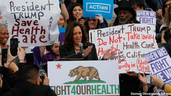AP17015806340498web California Senator Kamala Harris cheers health care workers to save the Affordable Care Act across the country, The rally was one of many being staged across the country. Credit: Damian Dovarganes/AP