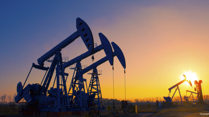 032817_01P_FS View of oil pumpjacks silhouetted against a sunset in Texas