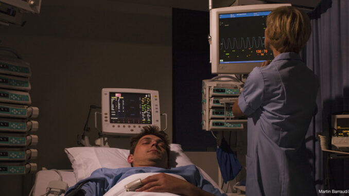 032817_03P_FS- Nurse tending patient in intensive care