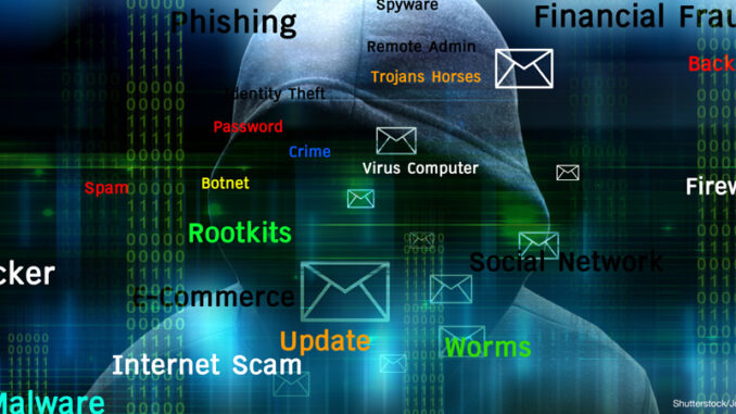 051717_02_FS Conceptual illustration showing a shadowing figure in a hoodie with binary numbers and various terms associated with computer hacking or cyber attacks