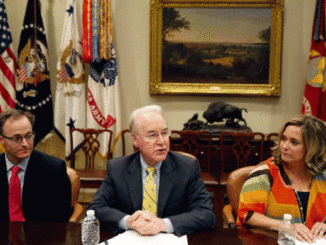 Dr. Douglas Lake, from Iowa, left, listens as Health and Human Services Secretary Tom Price, speaks, with Candace Fowler, from Missouri, at right, during a listening session in the Roosevelt Room of the White House,
