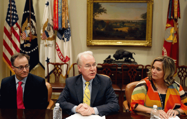 062817_01_IS Dr. Douglas Lake, from Iowa, left, listens as Health and Human Services Secretary Tom Price, speaks, with Candace Fowler, from Missouri, at right, during a listening session in the Roosevelt Room of the White House,