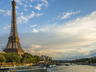 Beautiful sunset over Eiffel Tower and Seine river with puffy clouds, Paris, France
