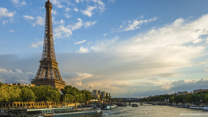 516505367 Beautiful sunset over Eiffel Tower and Seine river with puffy clouds, Paris, France