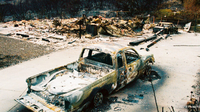 071717_02P_FS A burned out truck and twisted steel are all that remain of this home in Waterman Canyon that was destroyed by the fires.
