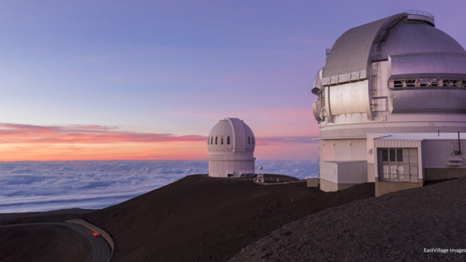 080217_03P_FS Mauna Kea telescopes at sunset on the Big Island of Hawaii. Credit: EastVillage Images/Shutterstock