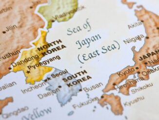 Detailed close-up view of a world map showing North Korea, South Korea, and Japan.