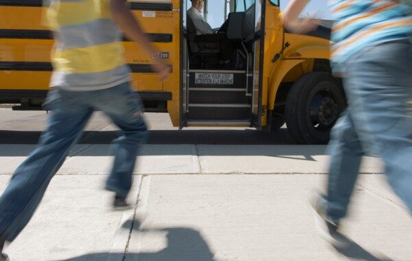 082817_01P_IS Schoolchildren running to school bus