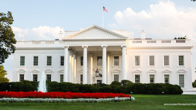 100917_02P_FS The White House n Washington, D.C. lit by the setting sun in the evening.