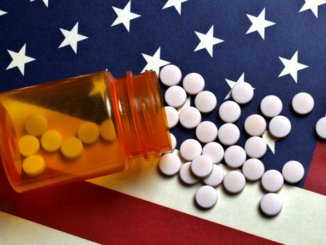 Prescription pills spilled on USA flag
