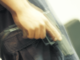 Close-up, mid section, view of a man holding a handgun