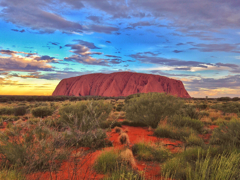 Scenic View Of Ayers Rock During Sunset