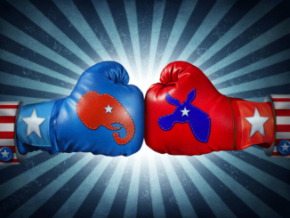 Republican versus Democrat. Close-up view of two boxing gloves, one with the Republican elephant symbol versus the Democrat donkey symbol, against a starburst background, fighting for the vote of an American election