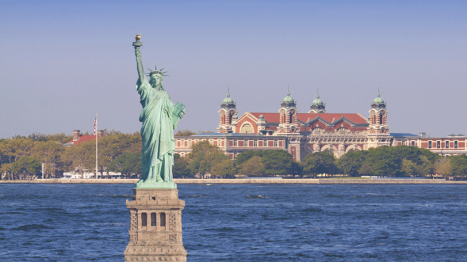 011618_01_IS Digital composite of the Statue of Liberty junxtaposed with Ellis Island in the background.