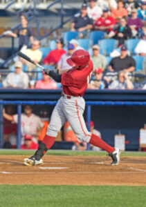 baseball player swinging at a pitch