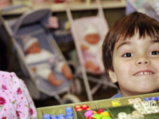 Children Looking Excitedly Over Toy Store Checkout Counter