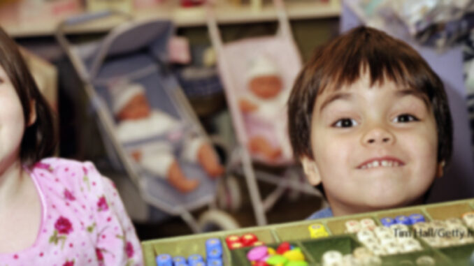032018_03P_FS Children Looking Excitedly Over Toy Store Checkout Counter