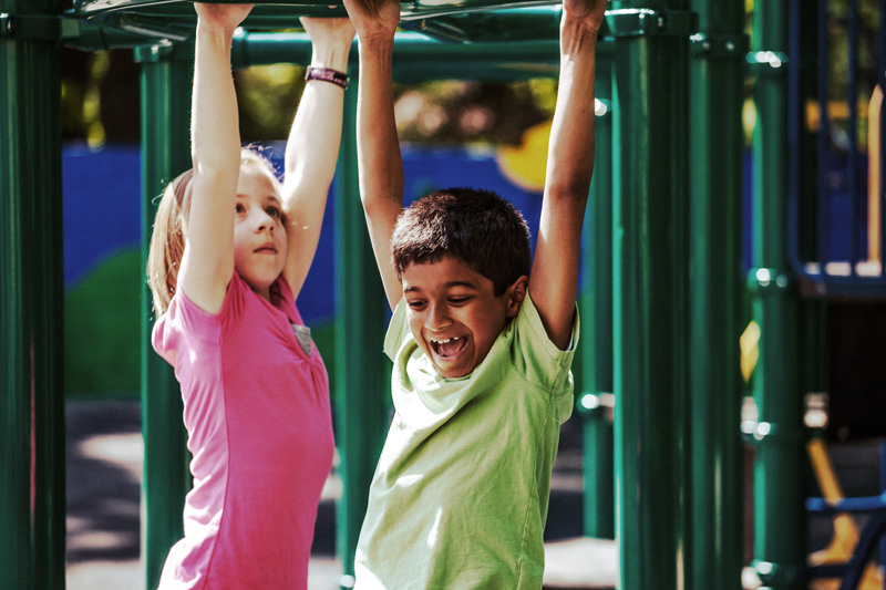 Playful Kids on playground equipment