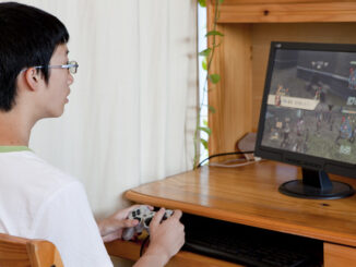 teenager playing video game