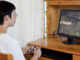 teenager playing video game