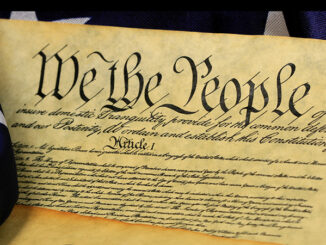 Constitution of the United States and American Flag, We The People