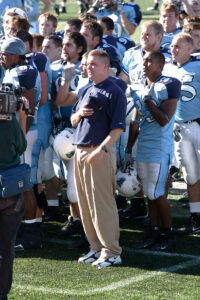 Coach and players during national anthem