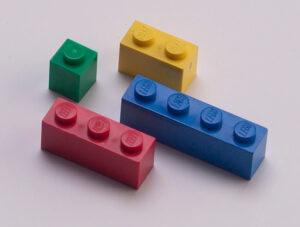 4 different colored lego blocks with 1, 2, 3, and 4 pegs