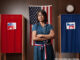 Filipino voter waiting to vote in polling place