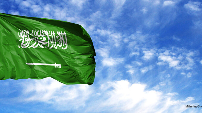 111918_02P_FS Flag of Saudi Arabia on flagpole against the blue sky