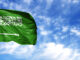 Flag of Saudi Arabia on flagpole against the blue sky