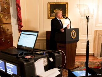 President Donald J. Trump, joined by senior White House staff, stands at a podium in the Map Room at the White House, during a prep sessions for President's State of the Union speech, Tuesday, Jan 30, 2018, in Washington, D.C.