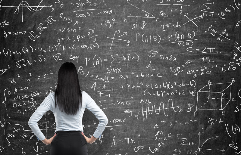 Women looking at math on board