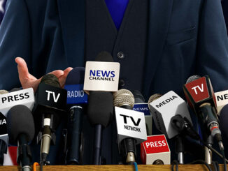 Mock up of politician at press conference podium