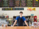 Male working at café counter