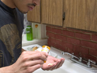 Guy taking pills