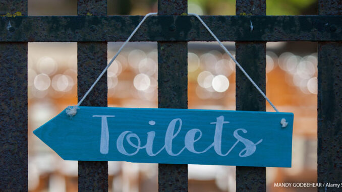 061719_01P_FS Sign of toilet on fence