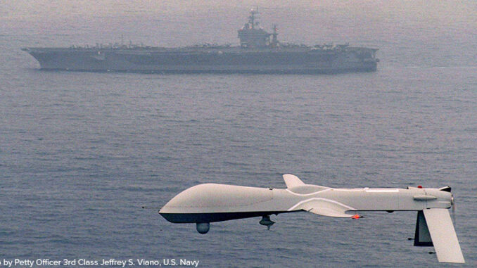 Aerial view of a Predator drone flying over the Pacific Ocean A Predator Unmanned Aerial Vehicle (UAV)